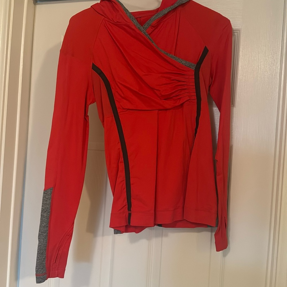 Lululemon Top with Hood that has a hole for Ponytail. Excellent used condition.